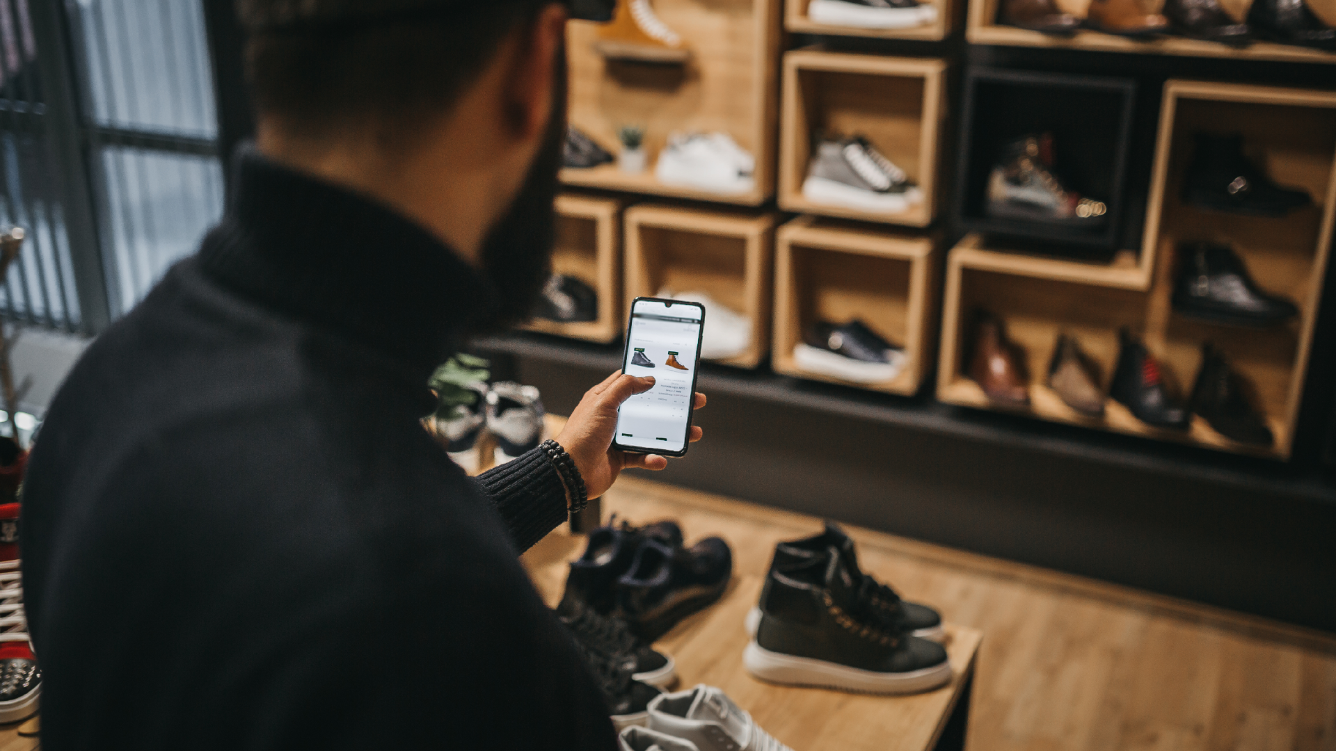 Man in shoe shop, shopping online